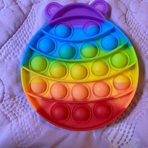 A rainbow round pop it